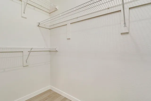 a view of a room with racks on the wall