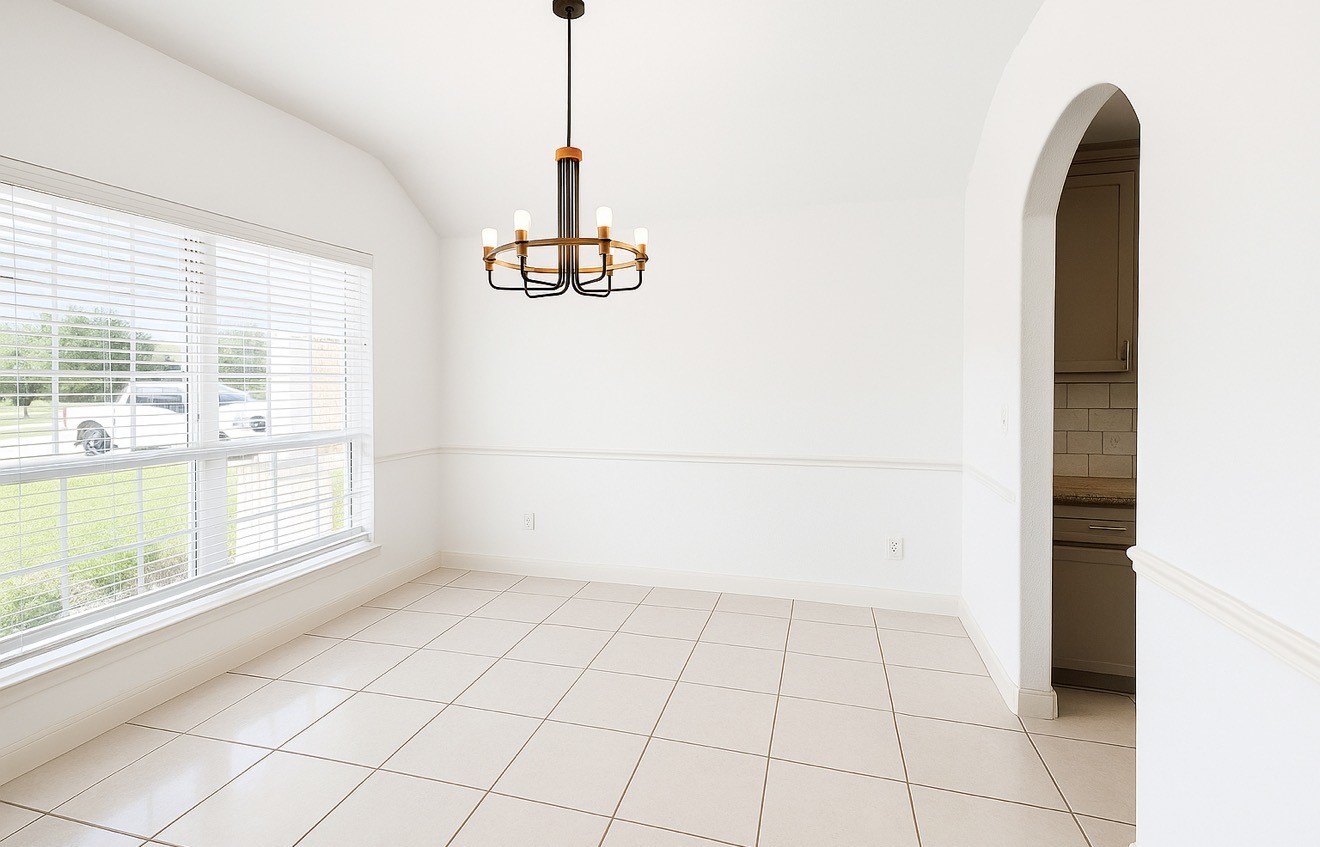 4915 Manor Stone Lane Rosenberg, TX 77469 - Photo 3 of 10 a view of an empty room with a window