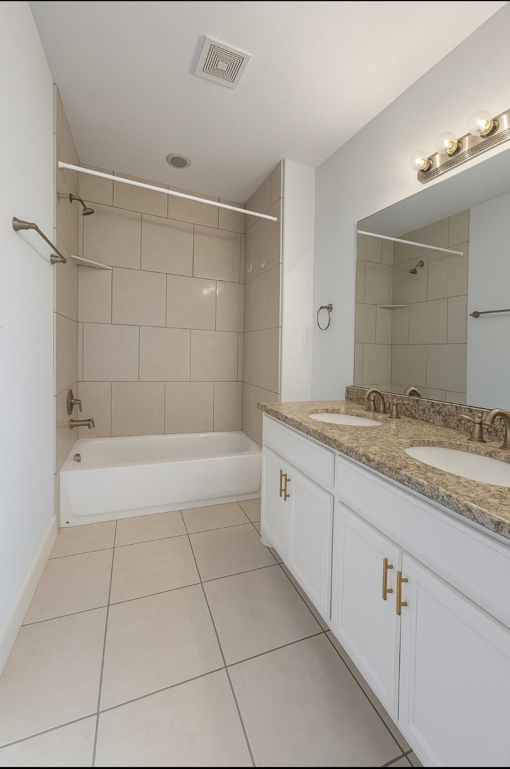 4915 Manor Stone Lane Rosenberg, TX 77469 - Photo 7 of 10 a spacious bathroom with a granite countertop sink a mirror and shower
