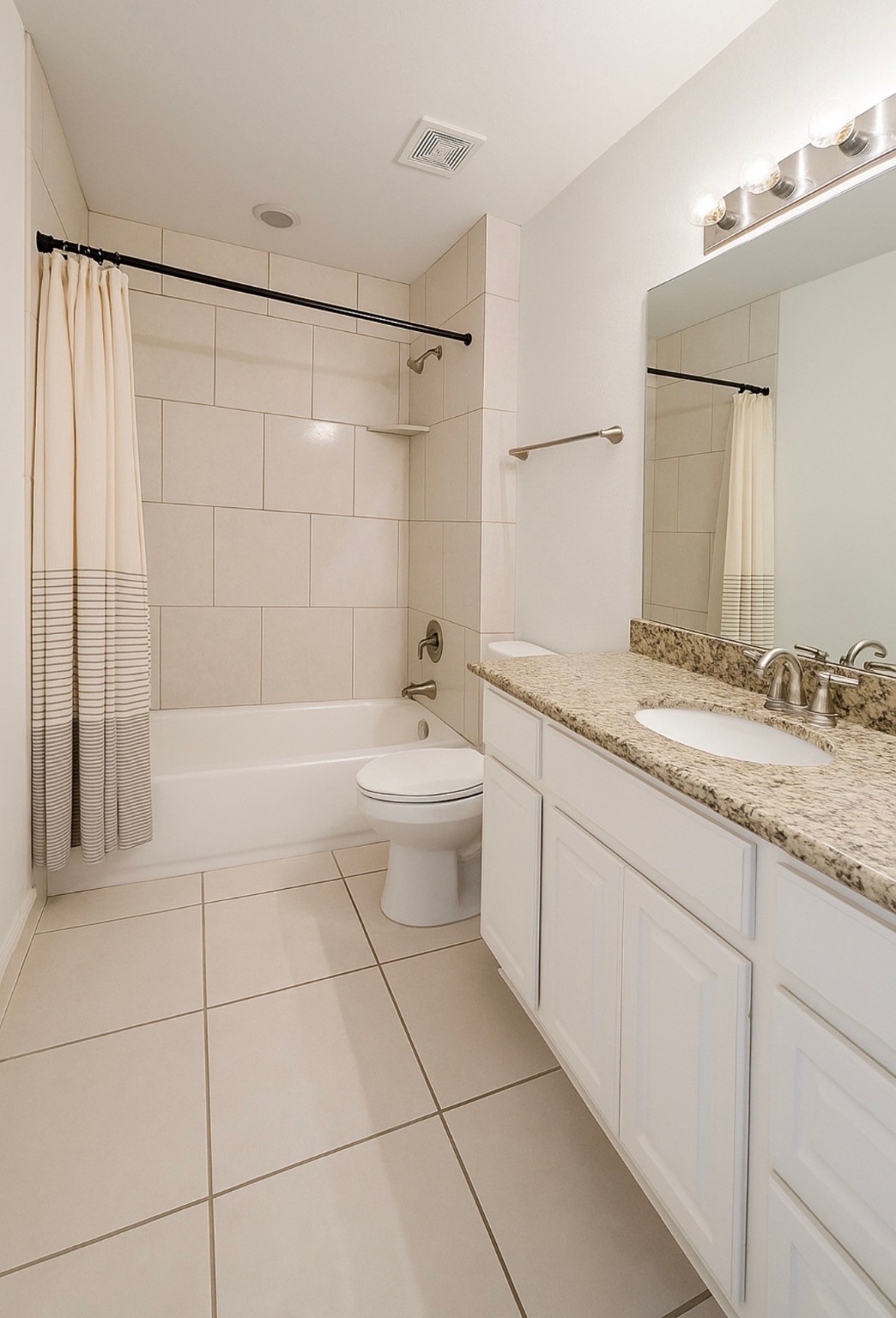 4915 Manor Stone Lane Rosenberg, TX 77469 - Photo 8 of 10 a bathroom with a granite countertop sink a toilet and shower