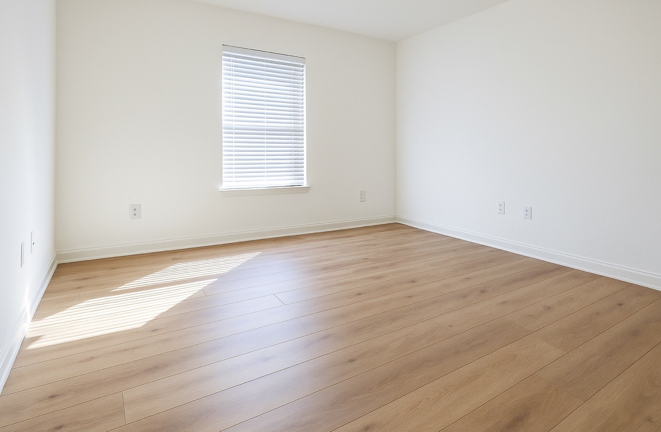 4915 Manor Stone Lane Rosenberg, TX 77469 - Photo 10 of 10 an empty room with wooden floor and windows