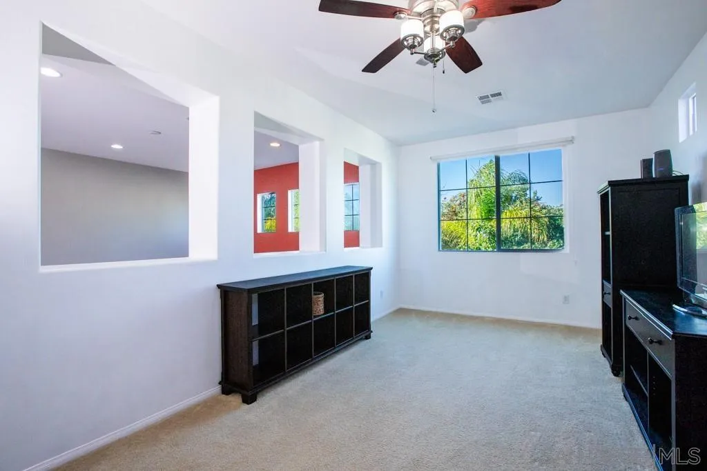 31340 Locust Court Temecula, CA 92592 - Photo 11 of 24 a view of living room with furniture and a flat screen tv