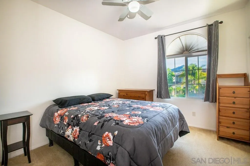 31340 Locust Court Temecula, CA 92592 - Photo 19 of 24 a bedroom with a bed and a window
