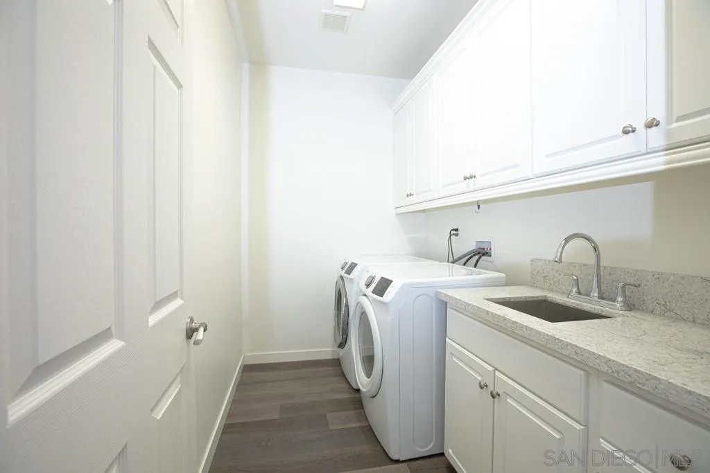 31340 Locust Court Temecula, CA 92592 - Photo 20 of 24 a utility room with sink dryer and washer