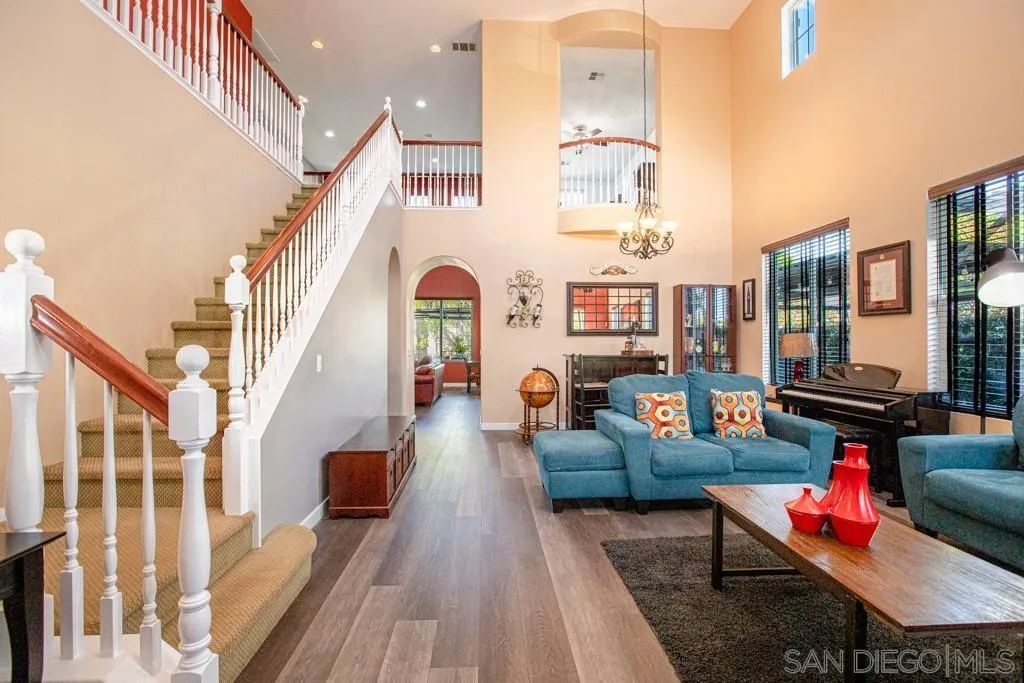 31340 Locust Court Temecula, CA 92592 - Photo 3 of 24 a living room with furniture and a floor to ceiling window