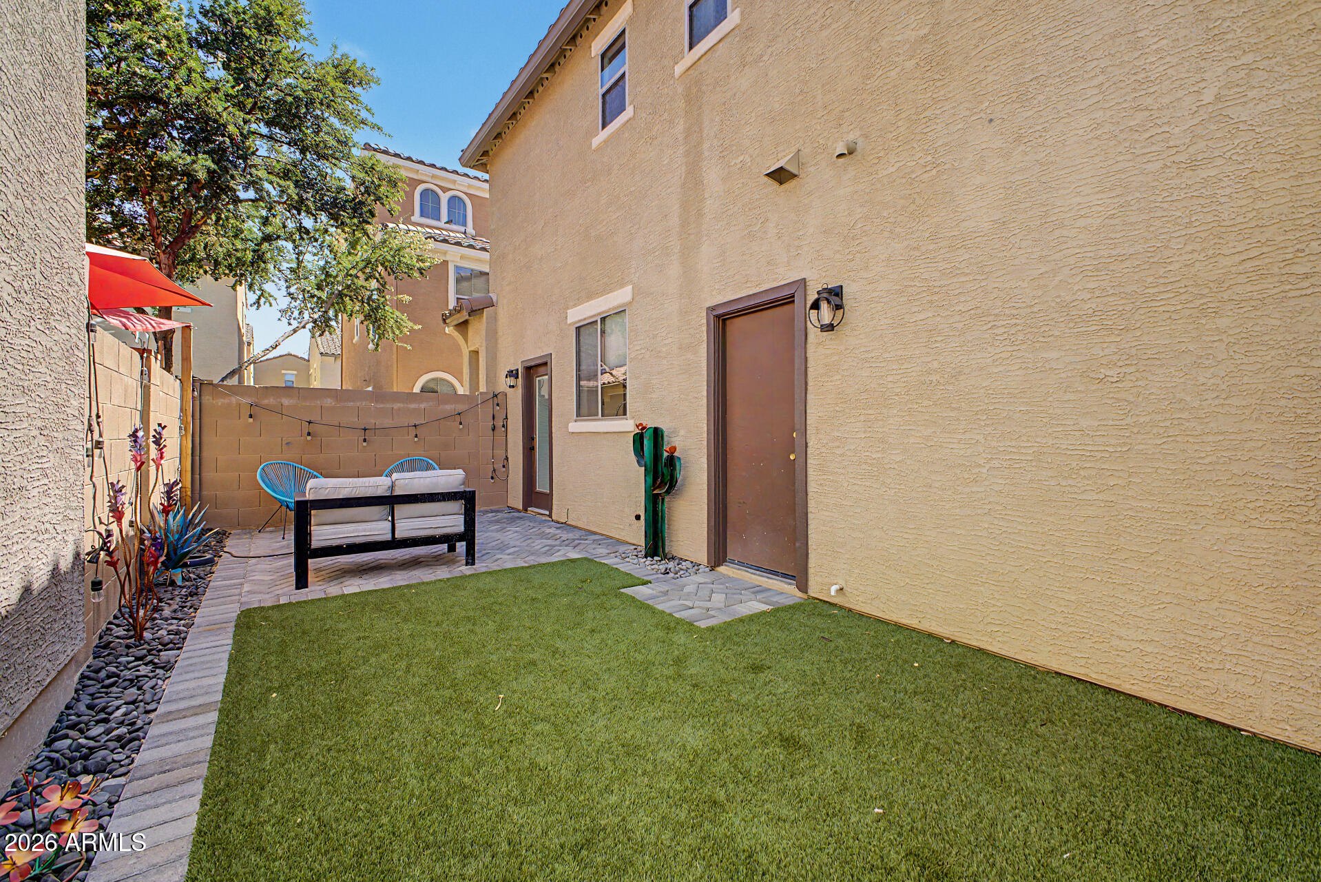 451 South Hawes Road, Unit 27 Mesa, AZ 85208 - Photo 27 of 27 a house view with a sitting space and garden