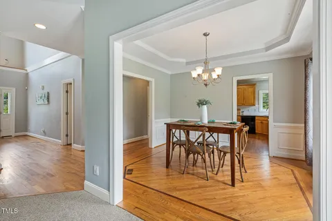 a view of a dining room with furniture and window