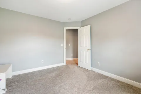 a bathroom with a granite countertop sink mirror and a bathtub