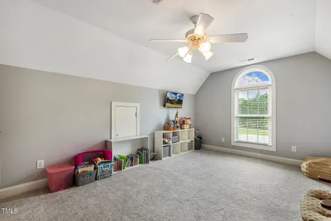 a view of a patio with a table and chairs