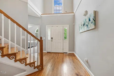 a view of front door with wooden floor