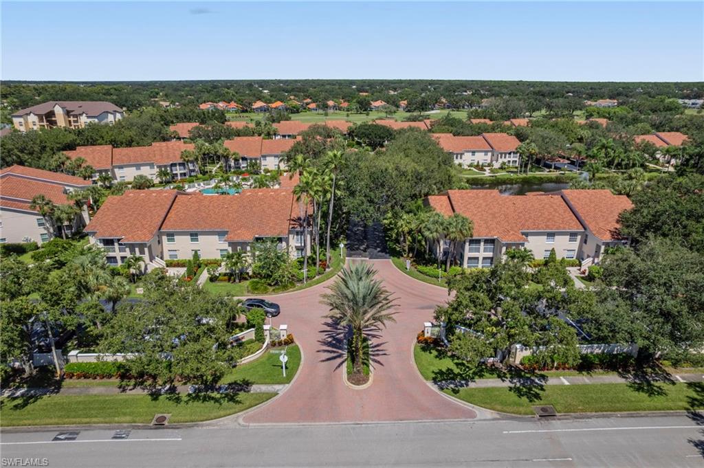 an aerial view of a house with yard
