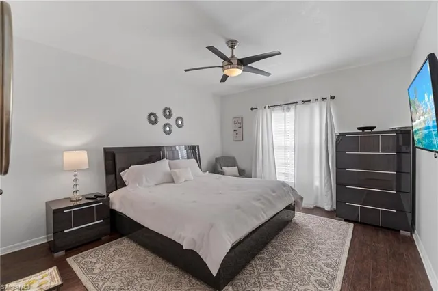 a bedroom with a bed and cabinet