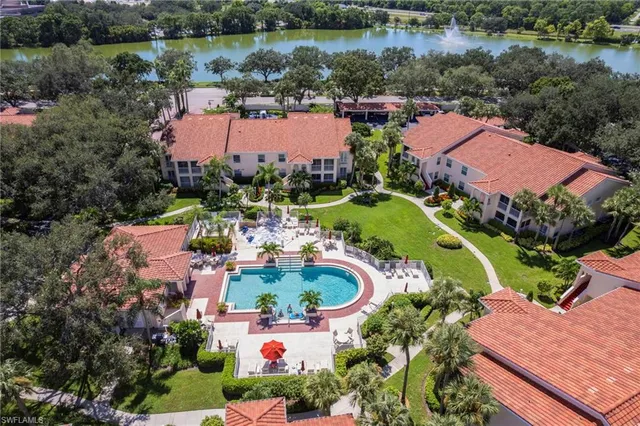an aerial view of a house with outdoor space and lake view