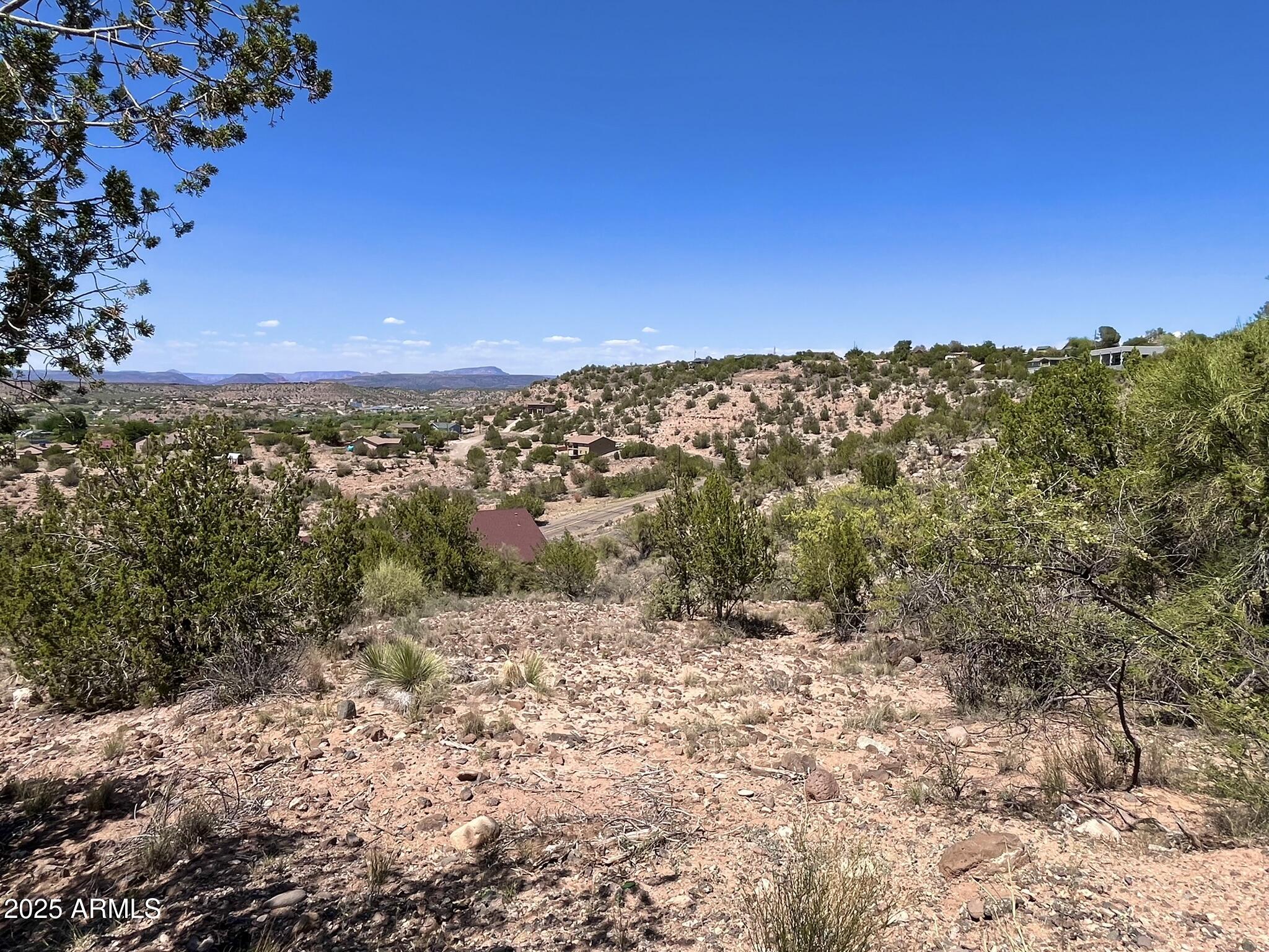 4660 East Navajo Lane, Unit 86 Rimrock, AZ 86335 - Photo 1 of 14 a view of a large building with a mountain in the background