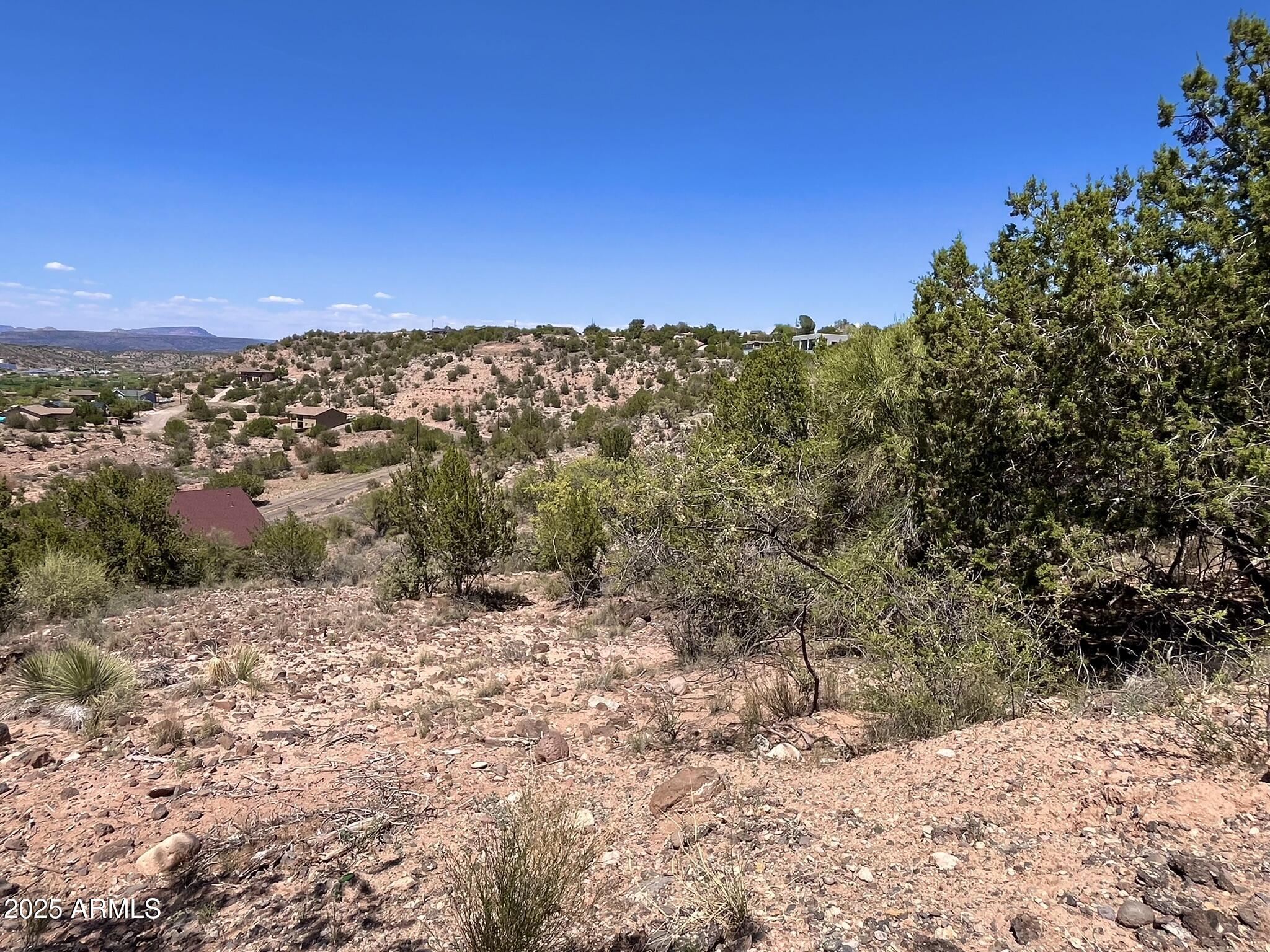 4660 East Navajo Lane, Unit 86 Rimrock, AZ 86335 - Photo 11 of 14 a view of a large building with a forest in the background