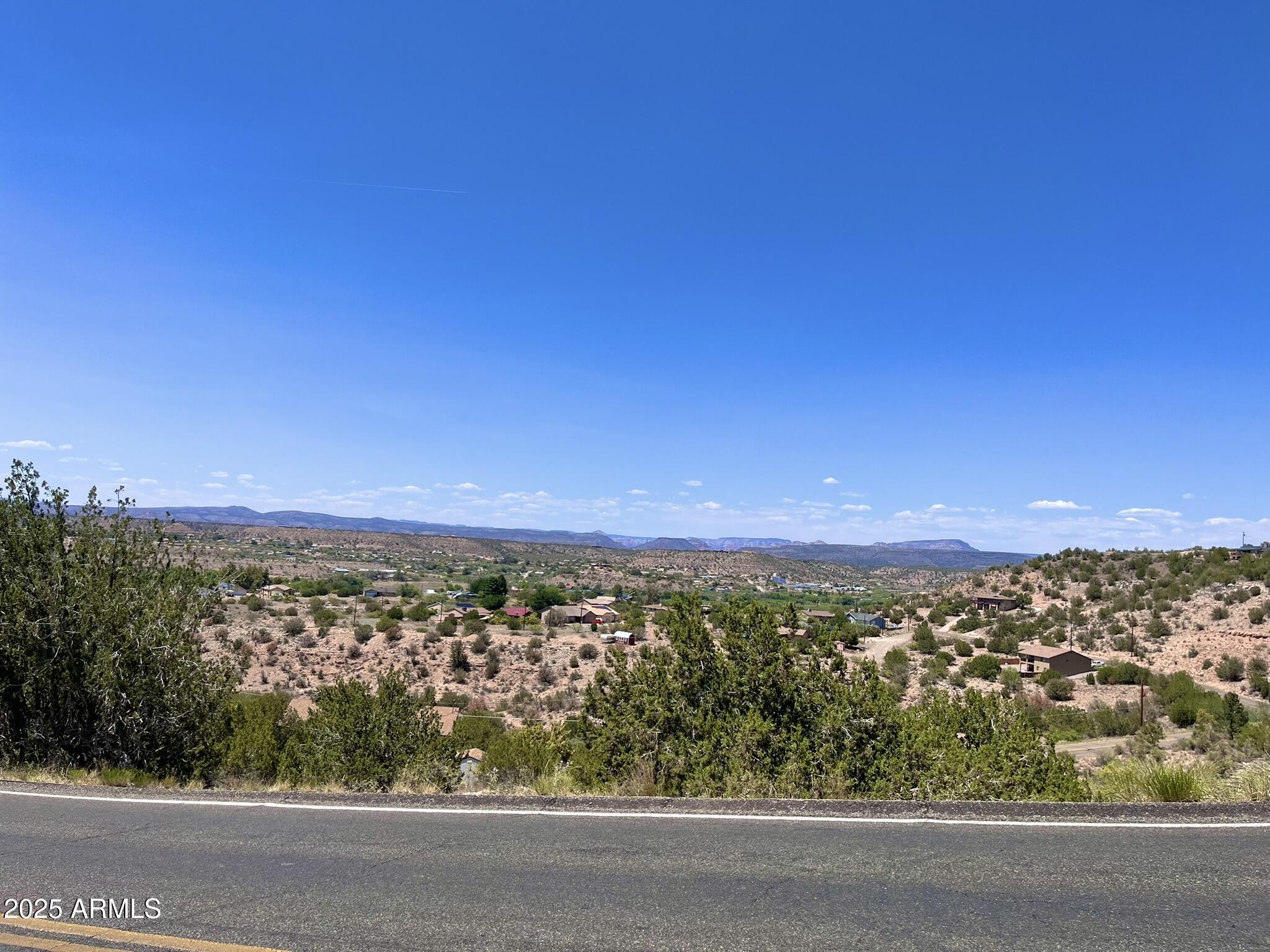 4660 East Navajo Lane, Unit 86 Rimrock, AZ 86335 - Photo 6 of 14 an aerial view of residential houses with outdoor space and trees