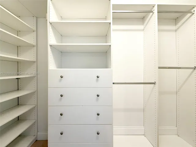 a view of an empty walk in closet