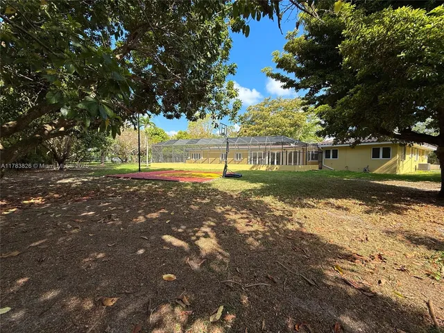 a view of a backyard with green space