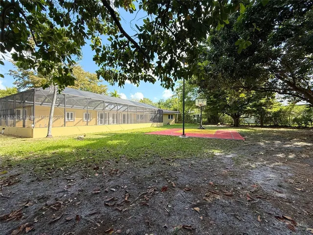 a view of outdoor space with deck and trees