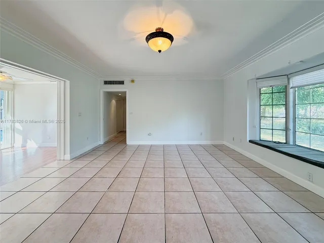 a view of an empty room and window