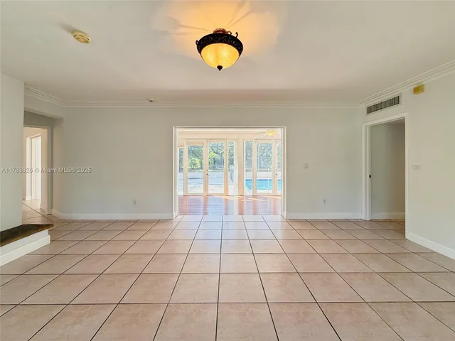 a view of an empty room and window