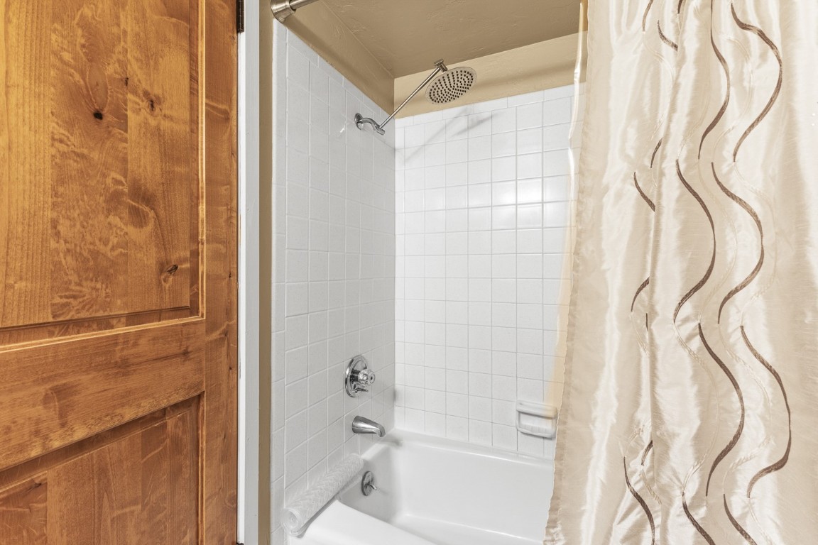 1945 Cornice Road, Unit 101D Steamboat Springs, CO 80487 - Photo 18 of 33 Full bathroom featuring shower / tub combo with curtain