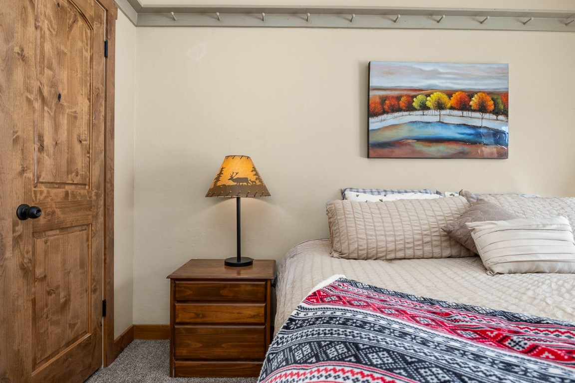 1945 Cornice Road, Unit 101D Steamboat Springs, CO 80487 - Photo 22 of 33 Carpeted bedroom featuring baseboards