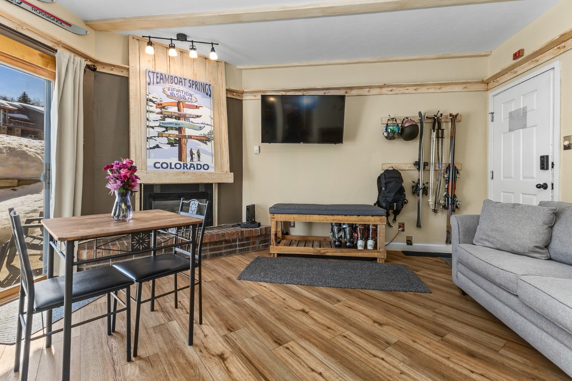 1945 Cornice Road, Unit 101D Steamboat Springs, CO 80487 - Photo 23 of 33 Living room with baseboards and wood finished floors