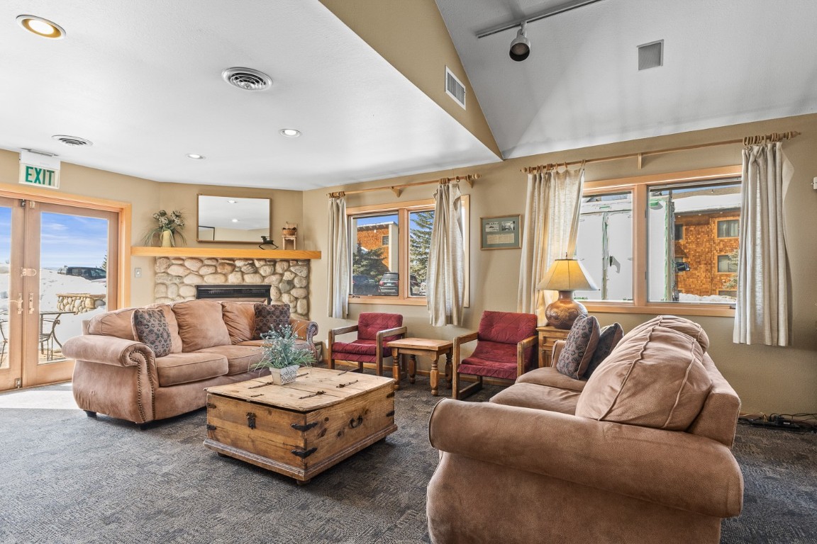 1945 Cornice Road, Unit 101D Steamboat Springs, CO 80487 - Photo 27 of 33 Living room featuring a fireplace