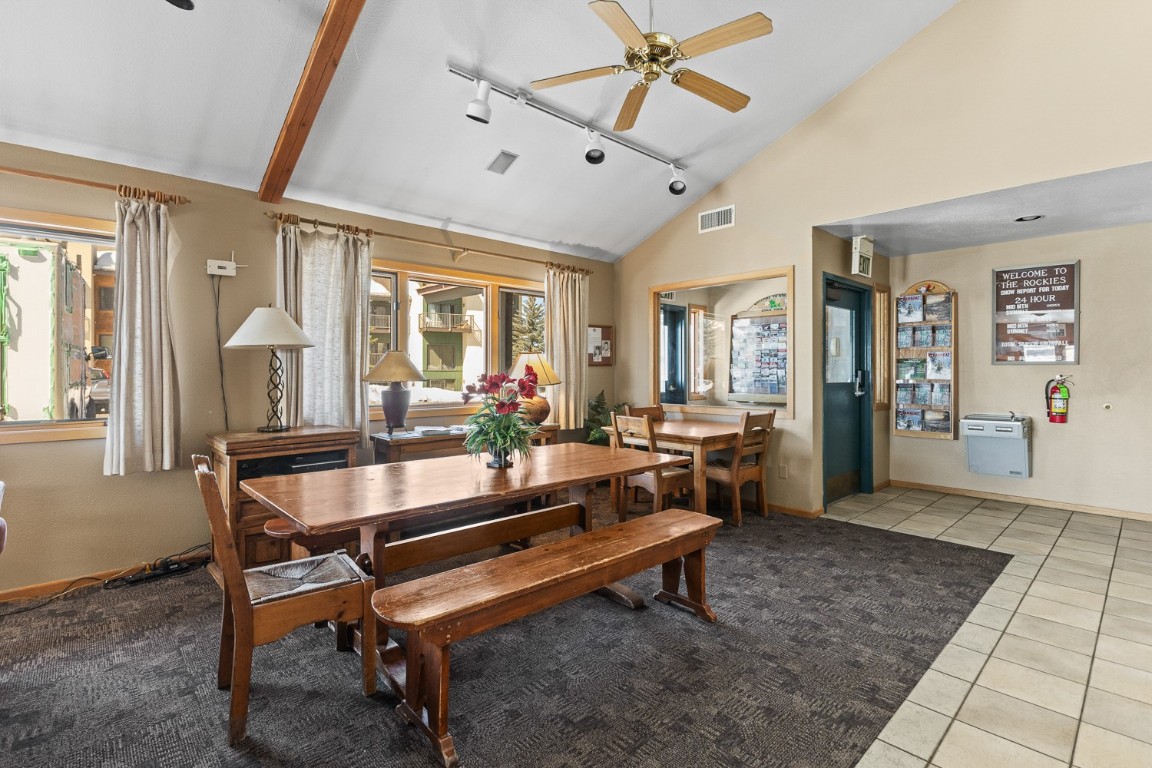 1945 Cornice Road, Unit 101D Steamboat Springs, CO 80487 - Photo 28 of 33 Dining space featuring visible vents, baseboards, rail lighting, light tile patterned flooring, and a ceiling fan
