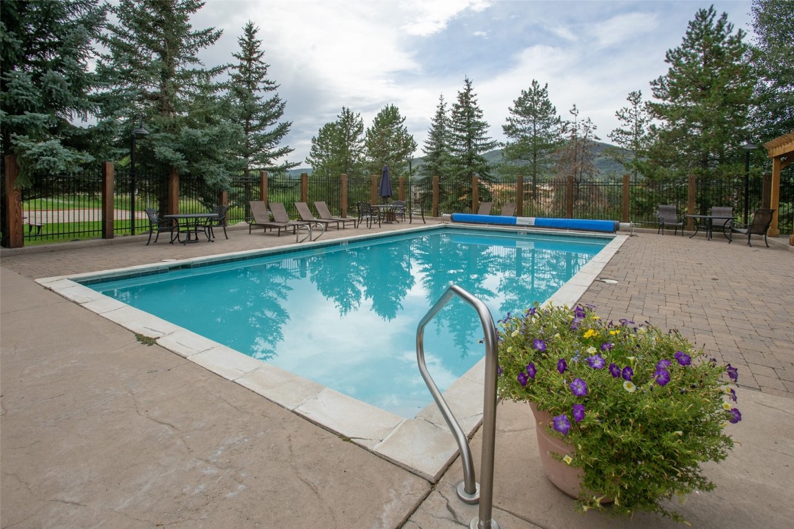 1945 Cornice Road, Unit 101D Steamboat Springs, CO 80487 - Photo 30 of 33 Community pool with a patio area and fence