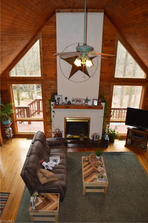551 Jackson Rd Extension Mount Airy, NC 27030 - Photo 1 of 49 Living room with wood floors, cathedral ceilings and gas logs