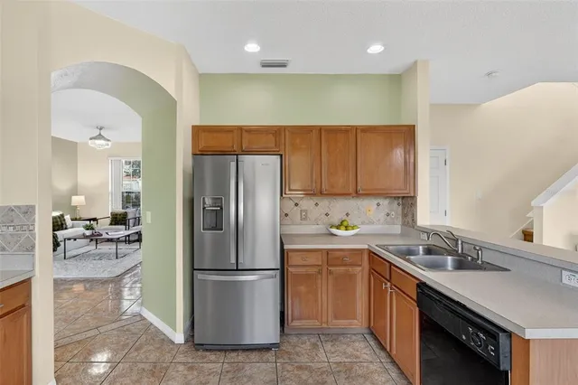 a bed room with a bed and a ceiling fan