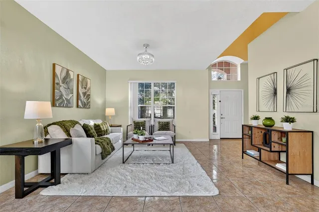 a living room with furniture and a table