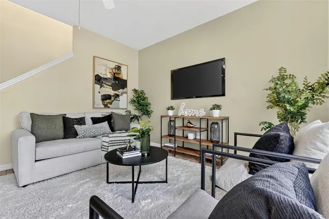 a bed room with a bed and a chandelier