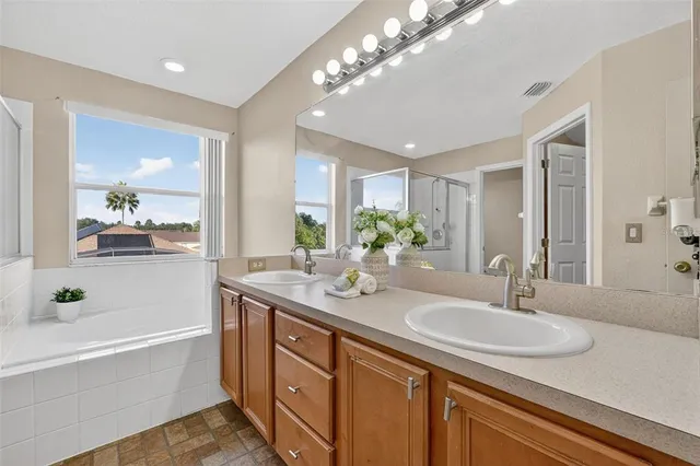 a view of a patio with table and chairs and potted plants