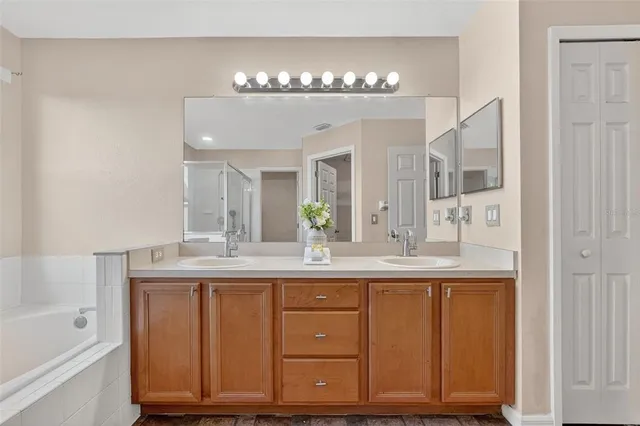 a front view of a house with a garden and yard