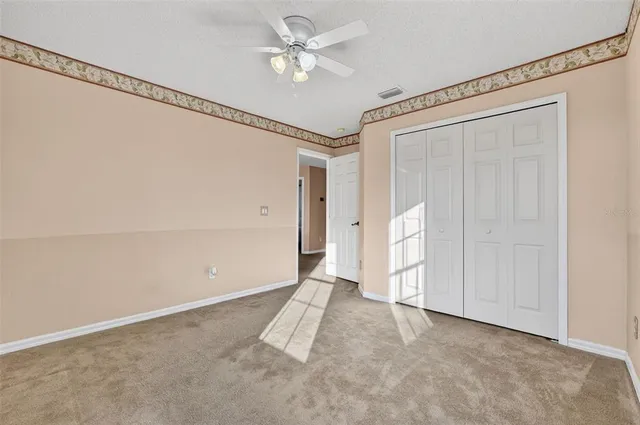 an aerial view of residential houses with outdoor space and street view