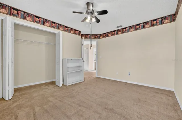 an aerial view of residential houses with outdoor space and parking