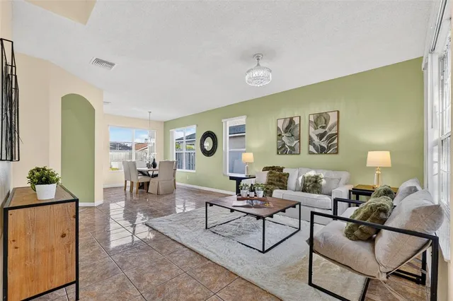 a kitchen with stainless steel appliances a refrigerator a stove a sink and a microwave