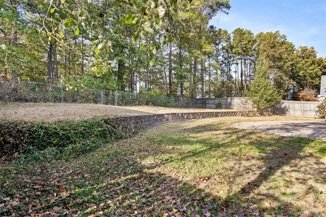 a view of outdoor space with trees all around
