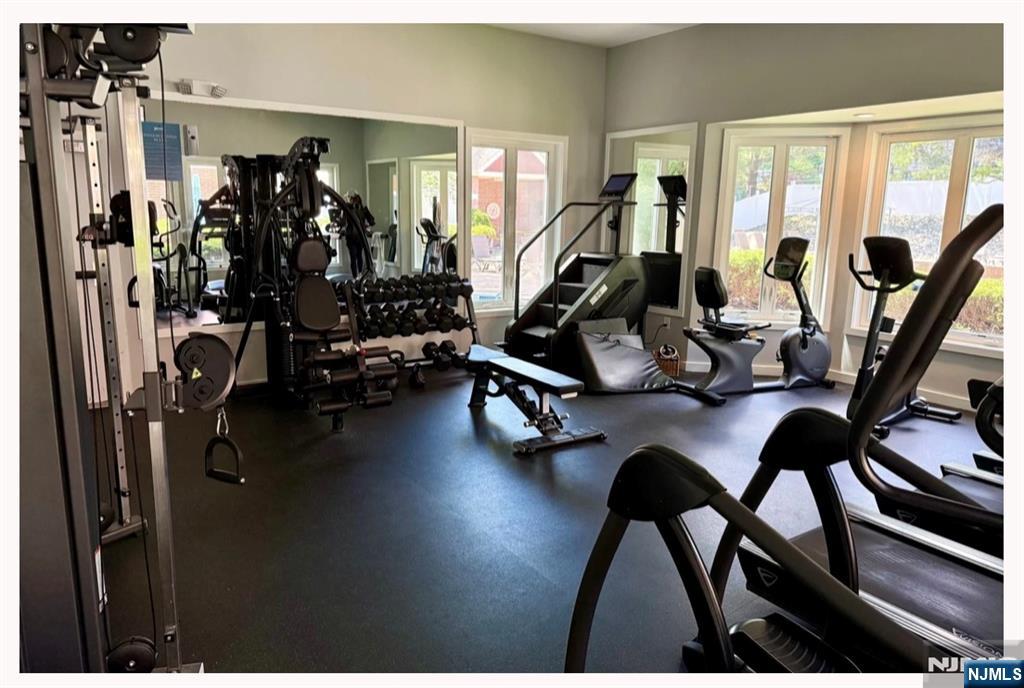 102 Nelson Court, Unit O102 Edgewater, NJ 07020 - Photo 11 of 15 a view of a room with gym equipment