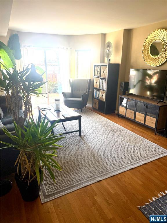 102 Nelson Court, Unit O102 Edgewater, NJ 07020 - Photo 4 of 15 a living room filled with furniture