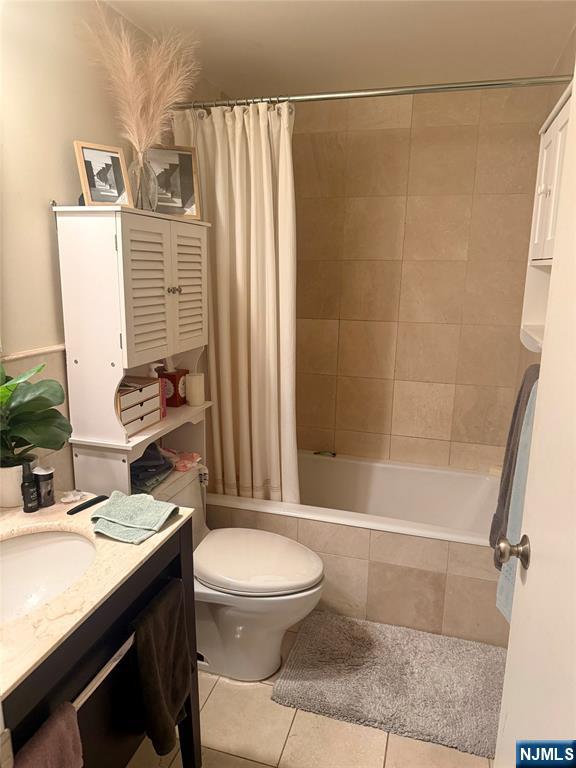 102 Nelson Court, Unit O102 Edgewater, NJ 07020 - Photo 5 of 15 a bathroom with a granite countertop sink toilet and shower