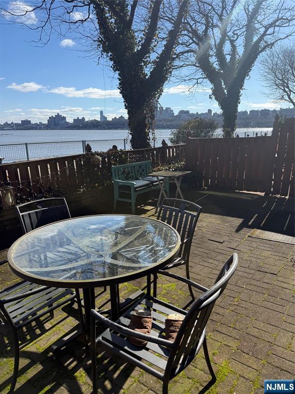 102 Nelson Court, Unit O102 Edgewater, NJ 07020 - Photo 10 of 15 a terrace of a house with outdoor seating
