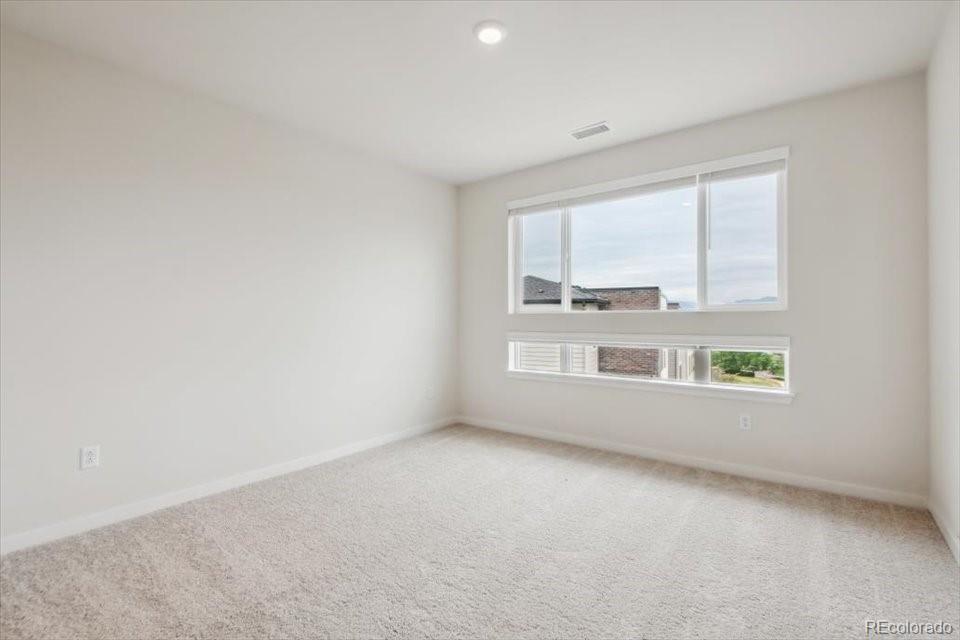 485 Interlocken Boulevard, Unit 305 Broomfield, CO 80021 - Photo 6 of 14 an empty room with a window