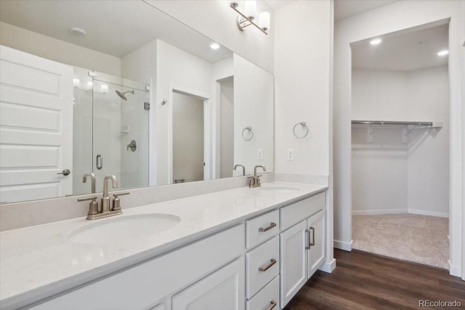 485 Interlocken Boulevard, Unit 305 Broomfield, CO 80021 - Photo 8 of 14 a bathroom with a sink double vanity and a mirror