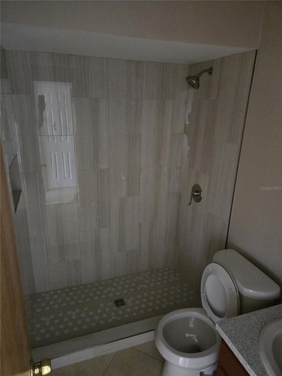 24862 US Highway 19 North, Unit 703 Clearwater, FL 33763 - Photo 23 of 24 a bathroom with a toilet and a shower