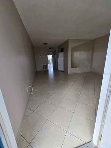 a view of a livingroom and entryway