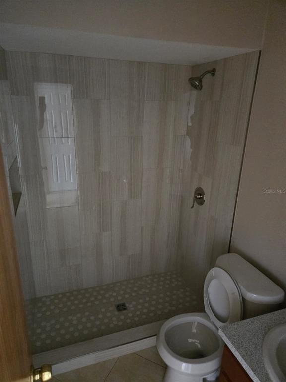 24862 US Highway 19 North, Unit 703 Clearwater, FL 33763 - Photo 8 of 24 a bathroom with a toilet and a shower